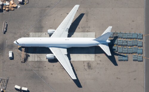 Aerial,view,of,unidentifiable,big,aircraft,for,freight,transport,with